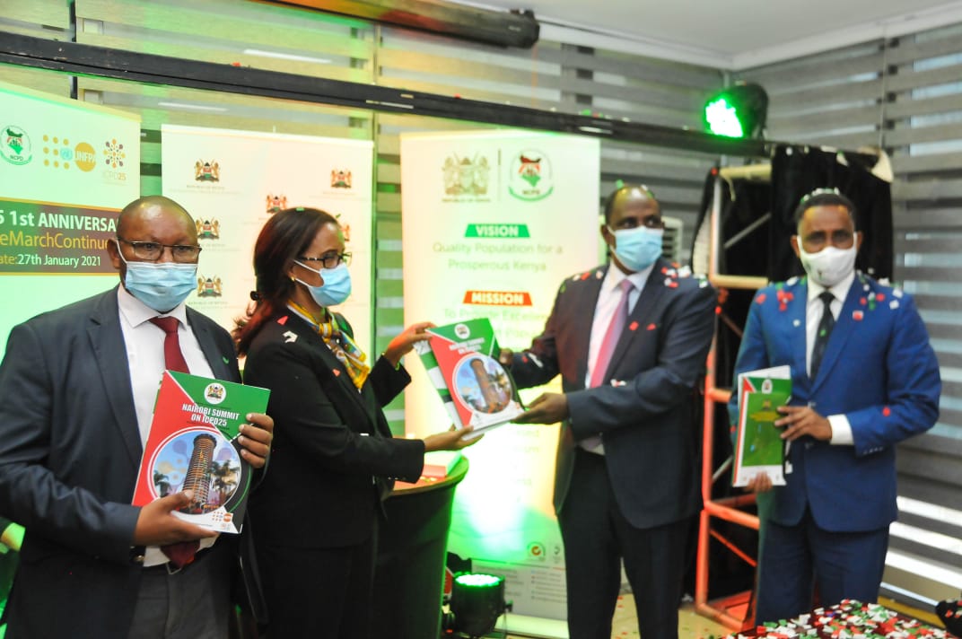 CS, Amb. Ukur Yatani and PS, Mr. Saitoti Torome, holding copies of the reports that were launched.